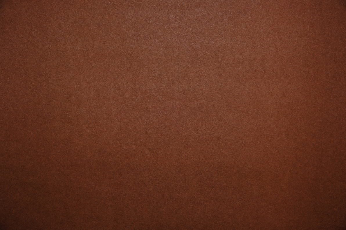 Bright brown background.Brown cardboard texture.